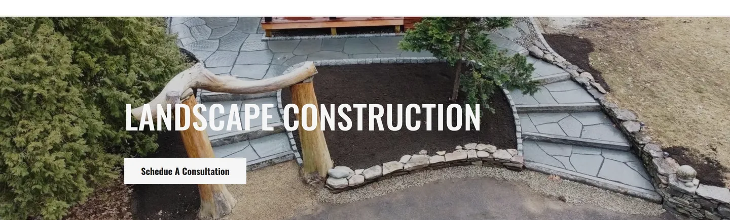 A landscape construction page leading with a finished stone walkway and a consultation button
